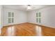 Bright bedroom with hardwood floors, ceiling fan and lots of natural light from shuttered windows at 186 Mt Calvary Rd, Marietta, GA 30064
