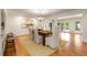 Elegant dining room featuring hardwood floors, a stylish light fixture, and access to patio at 186 Mt Calvary Rd, Marietta, GA 30064