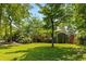 Lush lawn and mature landscaping surround a charming brick home at 186 Mt Calvary Rd, Marietta, GA 30064