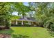 Traditional brick home with manicured lawn and mature landscaping at 186 Mt Calvary Rd, Marietta, GA 30064