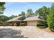 Lovely brick house featuring an attached garage and a beautifully paved driveway at 186 Mt Calvary Rd, Marietta, GA 30064