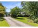 Long driveway leads to a brick home with mature trees at 186 Mt Calvary Rd, Marietta, GA 30064
