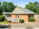 Exterior view showcasing a brick facade and a cozy, screened-in porch at 186 Mt Calvary Rd, Marietta, GA 30064