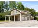Three-car garage with an open carport, featuring ample parking at 186 Mt Calvary Rd, Marietta, GA 30064