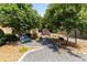 Inviting garden path with a charming bench, surrounded by lush landscaping at 186 Mt Calvary Rd, Marietta, GA 30064