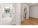 Hallway view leading to a full bathroom and walk-in closet for easy access and storage at 186 Mt Calvary Rd, Marietta, GA 30064