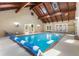 Stunning indoor pool area with skylights and exposed wood beams and multiple access doors at 186 Mt Calvary Rd, Marietta, GA 30064
