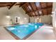 Bright indoor pool area featuring a vaulted ceiling with wooden beams and ample natural light at 186 Mt Calvary Rd, Marietta, GA 30064
