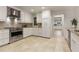Spacious updated kitchen with stainless steel appliances, tile floors, and white cabinets at 186 Mt Calvary Rd, Marietta, GA 30064