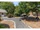 Professionally landscaped yard with stone pathway and bench at 186 Mt Calvary Rd, Marietta, GA 30064
