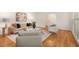 Open-concept living room with hardwood floors, a fireplace, and neutral decor at 186 Mt Calvary Rd, Marietta, GA 30064