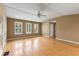 Cozy living room with large windows, hardwood floors and a ceiling fan at 186 Mt Calvary Rd, Marietta, GA 30064