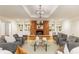 Cozy living room featuring a brick fireplace, built-in bookshelves, and plush seating at 186 Mt Calvary Rd, Marietta, GA 30064