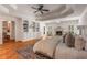 Main bedroom boasts hardwood floors, a fireplace, built-in bookshelves and a tray ceiling at 186 Mt Calvary Rd, Marietta, GA 30064