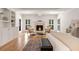 Large main bedroom with hardwood floors, built-in storage, seating area and a fireplace at 186 Mt Calvary Rd, Marietta, GA 30064