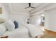 Sunlit main bedroom featuring hardwood floors, ceiling fan and view to a sitting area at 186 Mt Calvary Rd, Marietta, GA 30064