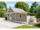 Exterior shot of the outbuilding with a neutral color, featuring multiple entry points at 186 Mt Calvary Rd, Marietta, GA 30064