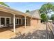 Expansive wooden patio with ceiling fan and access to the home through glass doors at 186 Mt Calvary Rd, Marietta, GA 30064