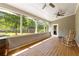 Relaxing screened porch with ceiling fans and rocking chairs at 186 Mt Calvary Rd, Marietta, GA 30064