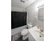 Functional bathroom with a shower-tub, white vanity, and modern fixtures for a refreshing experience at 359 Dallas St, Hiram, GA 30141