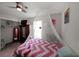 Bright bedroom with zig-zag bedding, walk-in closet, and ceiling fan at 359 Dallas St, Hiram, GA 30141