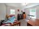Comfortable bedroom with plush carpet floors, a large window, and a cozy atmosphere, perfect for rest and relaxation at 359 Dallas St, Hiram, GA 30141