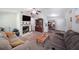 Comfortable living room with a fireplace, neutral colors, carpet floors, and a ceiling fan for added comfort at 359 Dallas St, Hiram, GA 30141
