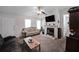 Inviting living room featuring a cozy fireplace, neutral carpet floors and a light gray color scheme at 359 Dallas St, Hiram, GA 30141