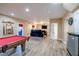 Finished basement with plank flooring, theater seats, a pool table, and access to a bathroom at 3623 Terrah Point Dr, Duluth, GA 30097