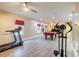 Spacious basement featuring plank flooring, exercise equipment, and a pool table at 3623 Terrah Point Dr, Duluth, GA 30097