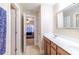 Well-lit bathroom showcases a double vanity sink, tiled floors, and leads to a bedroom offering both style and functionality at 3623 Terrah Point Dr, Duluth, GA 30097