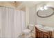 Bathroom featuring a shower with curtain, a toilet, and a vanity with an oval mirror at 3623 Terrah Point Dr, Duluth, GA 30097