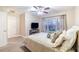 Bedroom with plush carpet, ceiling fan, and window offering natural light at 3623 Terrah Point Dr, Duluth, GA 30097
