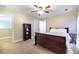 Bedroom featuring carpet, ceiling fan, and shelf with decorative teddy bear at 3623 Terrah Point Dr, Duluth, GA 30097