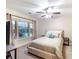 Bedroom with plush carpet, ceiling fan, and window offering natural light at 3623 Terrah Point Dr, Duluth, GA 30097