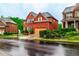 Brick two-story home boasts manicured landscaping, and a two-car garage, complemented by nearby trees at 3623 Terrah Point Dr, Duluth, GA 30097
