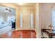 Inviting foyer features hardwood floors, natural light, and access to other rooms in the home at 3623 Terrah Point Dr, Duluth, GA 30097