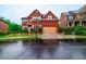 Beautiful two-story brick home boasts a two-car garage, manicured landscaping, and inviting curb appeal at 3623 Terrah Point Dr, Duluth, GA 30097