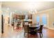 Bright kitchen area showcasing stainless steel appliances, granite countertops, and dining table with chairs at 3623 Terrah Point Dr, Duluth, GA 30097
