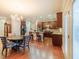 Open concept kitchen featuring stainless appliances, wooden cabinets, and a large dining area at 3623 Terrah Point Dr, Duluth, GA 30097