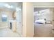 Laundry room with washer, dryer and a view into an adjacent bedroom at 3623 Terrah Point Dr, Duluth, GA 30097
