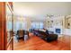 Spacious living room with hardwood floors, fireplace, built-in shelving, and a comfortable seating area at 3623 Terrah Point Dr, Duluth, GA 30097