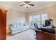 Cozy home office with large windows, comfortable seating, and a functional workspace at 3623 Terrah Point Dr, Duluth, GA 30097