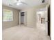 Spacious bedroom with a ceiling fan, large closet, and an en-suite bathroom at 6553 Parkside Way, Tucker, GA 30084