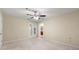 Neutral bedroom with a ceiling fan, French doors, and an ensuite bath at 6553 Parkside Way, Tucker, GA 30084