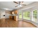 Eat-in kitchen offers wood cabinets, laminate floor, breakfast area, and bright bay window at 6553 Parkside Way, Tucker, GA 30084