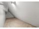 Unfinished bonus room featuring an angled ceiling and wire shelving at 6553 Parkside Way, Tucker, GA 30084