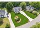 Aerial view of home on a large lot with mature trees and a long driveway at 6890 Autumn Hills Dr, Cumming, GA 30028