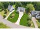 Aerial view of home on a large lot with mature trees and a long driveway at 6890 Autumn Hills Dr, Cumming, GA 30028