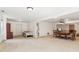 Finished basement area with bed, bathroom view, and dining set at 6890 Autumn Hills Dr, Cumming, GA 30028